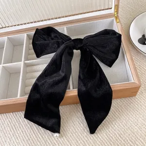 Elegant French vintage black velvet bow hair clip with a pearl accent for women