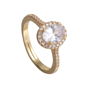 Elegant adjustable gold ring with large oval clear cubic zirconia and halo diamond accents