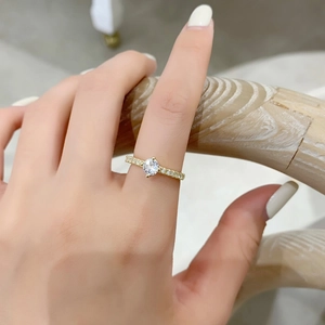 Elegant gold ring with a large zircon center stone and micro-pave setting for women