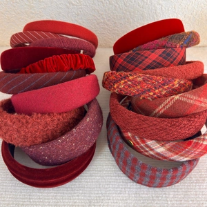 Detail view of burgundy velvet and tweed headband set with various textures and patterns