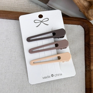 Three-piece set of matte brown and beige hollow water drop hair clips on white card