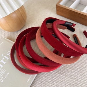 Set of padded red headbands in velvet and silk fabrics with handmade woven label detail
