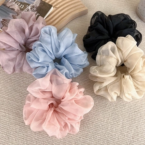 5-pack of elegant organza scrunchies in pastel colors on a stylish woven background