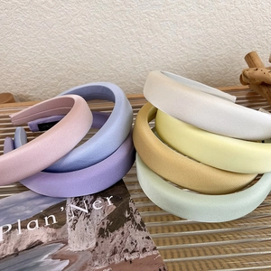 Glossy satin sponge padded headband in various candy colors for a retro volumed hair look