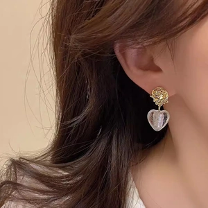 French retro heart rose drop earrings for women showing realistic ear-wearing view