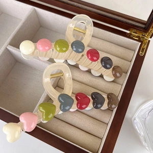 Rainbow resin hair claw clips with heart and dot patterns for elegant women's hairstyling