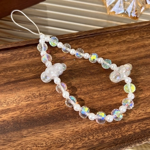 Detailed macro of colorful crystal beads and pearls on a premium wooden display tray