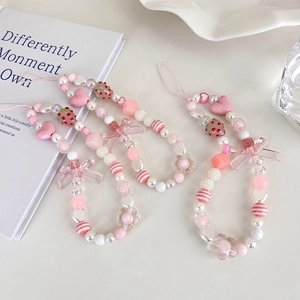 Pink strawberry beaded phone charm set with heart and bow details for women