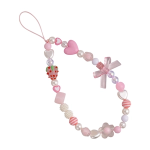 Pink and white beaded phone charm with strawberry, heart, and bow acrylic elements