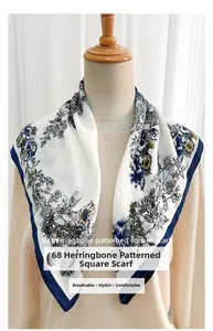 Detailed view of beige square scarf with blue star print and herringbone texture