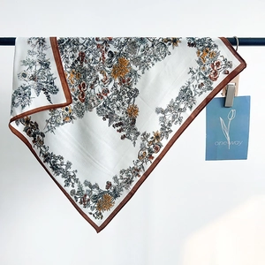 Elegant floral print square scarf with silk texture and contrasting brown border design