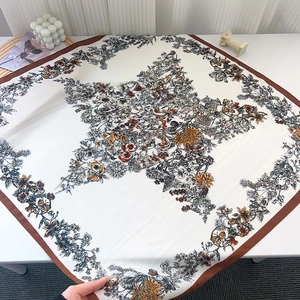 Flat lay of star print scarf featuring vintage floral patterns and butterfly motifs