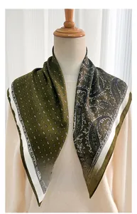 Detail of navy blue paisley silk scarf with herringbone pattern and white borders