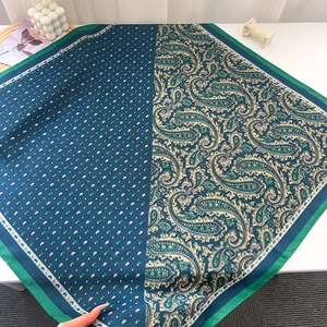 Detailed pattern view of navy paisley and polka dot silk square scarf for women