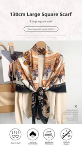 Detail of horse carriage print scarf with fringe edges in orange and cream tones