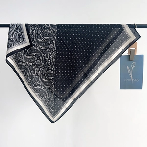 French vintage navy paisley and polka dot silk scarf displayed on a white background