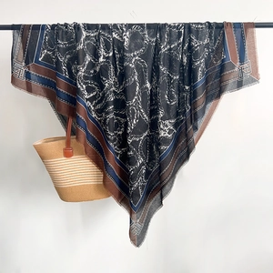 Detail showing the rope pattern and tassel texture of a large cotton linen scarf shawl