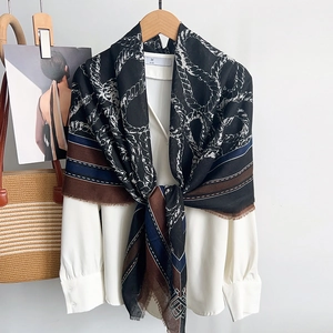 Elegant rope chain print scarf with tassels, featuring black, white and brown color block design