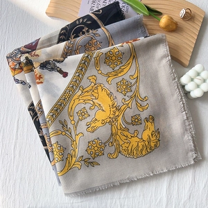 Elegant silk-like square scarf featuring horse carriage baroque print with fringe edges