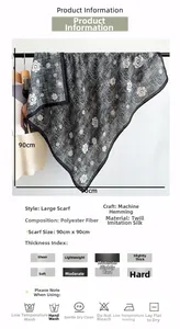 Detail view of 90x90cm camellia pattern silk scarf showing specifications and texture