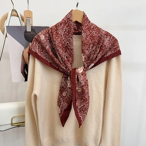 Elegant wine red floral silk shawl with white camellia patterns on beige sweater