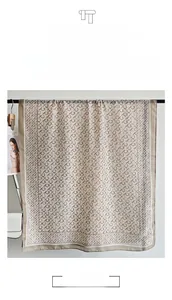 Close-up of elegant scarf featuring contrast print patterns and draped silk texture