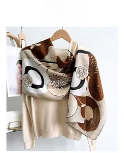 Detail of camellia flower print on large lightweight cotton linen scarf with silk-like sheen