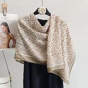 Elegant beige cotton linen scarf with red-brown monogram print and striped borders