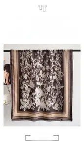 Detail view of French vintage coffee brown cotton linen scarf with thistle plant patterns
