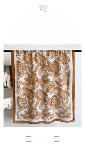 Detail view of retro brown floral print cotton linen scarf with thick and draped texture