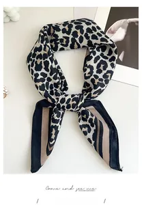 Detail of leopard print silk scarf with herringbone texture in beige and dark brown