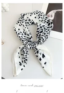 Detail of herringbone texture fabric on leopard print small square neck scarf