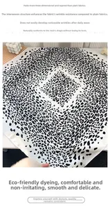 Detailed view of leopard print square scarf featuring premium anti-wrinkle woven texture