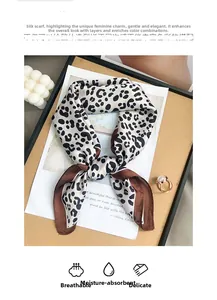 Detail showing high-quality leopard print silk scarf with smooth texture and vintage edges
