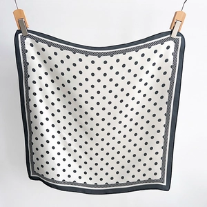 Polka dot silk square scarf with black and white Hepburn style hanging display
