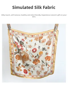 Close-up of elegant floral pattern on cream silk scarf with warm orange flowers