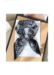 Detailed texture of black and white paisley silk scarf with breathable fine fabric