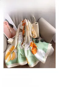 Detailed macro view of the floral print silk scarf draped over a leather bag