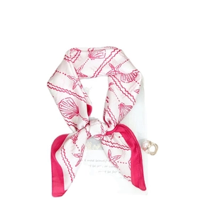 Elegant white silk scarf with pink starfish shell pattern tied in a stylish bow