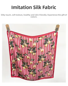 Vue détaillée d'un foulard en soie avec imprimé citron et rayures rouges