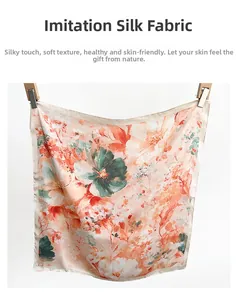 Close-up of floral faux silk square scarf showing silky texture and machine-stitched edges