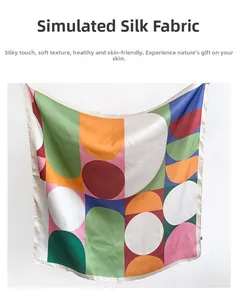 Detailed close-up showing the smooth texture and colorful geometric patterns of the silk scarf
