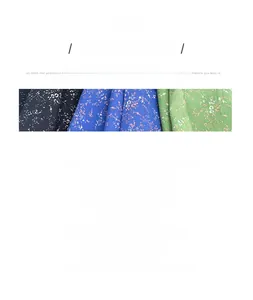 Detailed view of three floral patterns on 100% cotton square scarves in blue and green