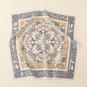 Detailed view of vintage animal print silk scarf with classic European style patterns