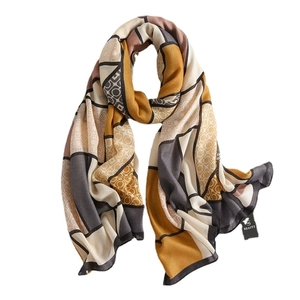 Sciarpa moderna con stampa geometrica nei toni giallo zenzero e grigio per l'inverno