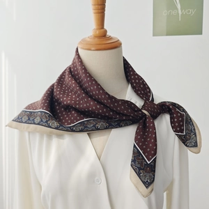 Vintage dark brown silk scarf with houndstooth and paisley patterns on white shirt