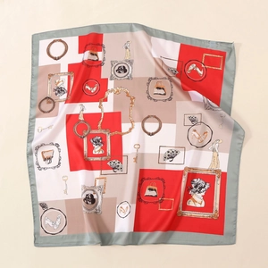 Detailed pattern of a vintage satin scarf featuring retro illustrations and silk texture