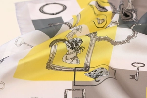 Detail of yellow and grey satin scarf with retro silhouette and geometric pattern