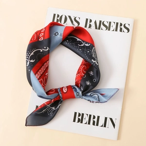 Detail of red and navy blue paisley print satin scarf with premium rolled edge stitching