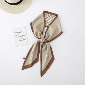 Detail of khaki satin skinny scarf with letter B print and elegant contrast edges
